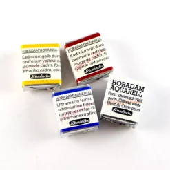 Caja metálica 24 medios godets de acuarela Akademie Schmincke